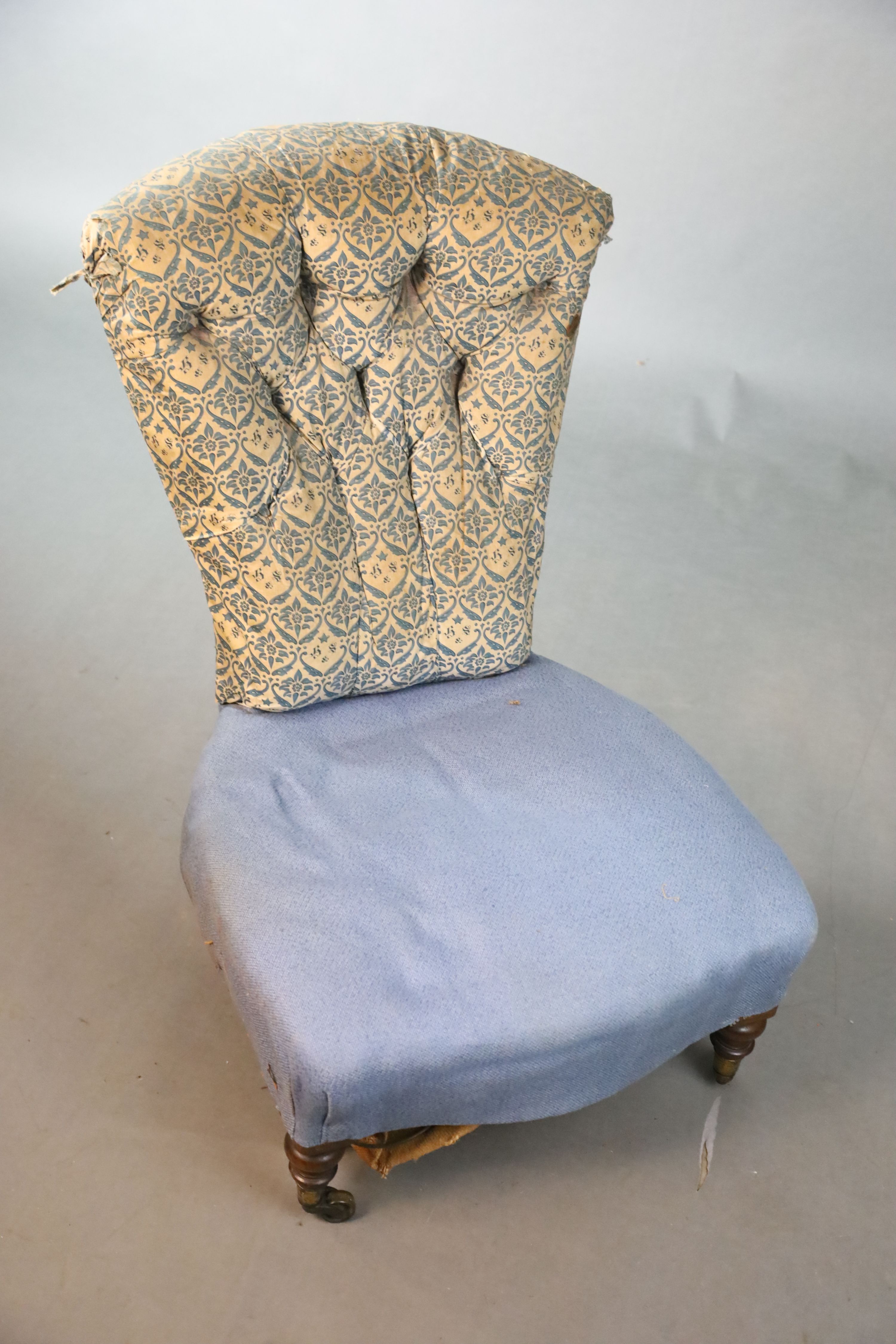 A Victorian Howard & Sons walnut buttoned back nursing chair, W.58.5cm D.81.5cm H.86.5cm